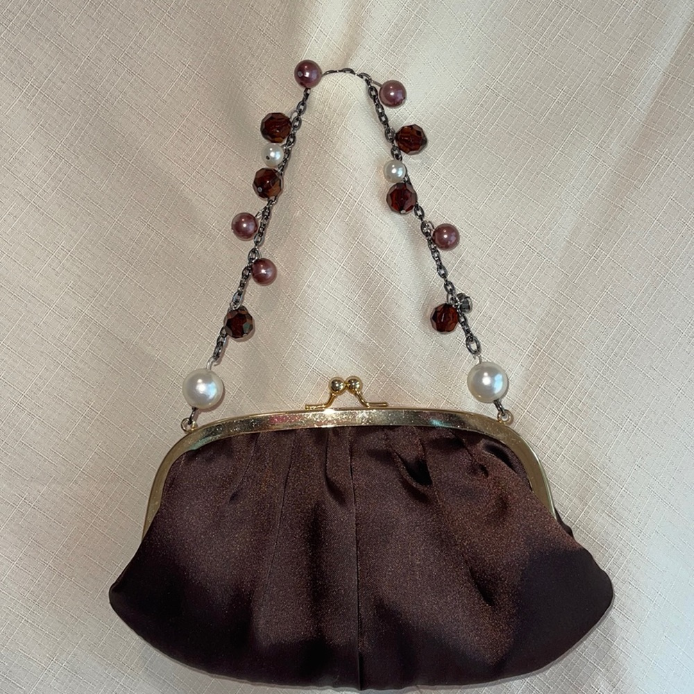 Handbag with beaded handle